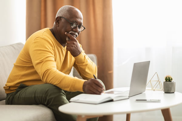 man-working-smart man working from the couch